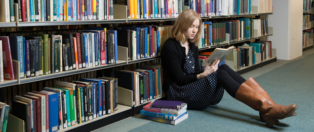 Photo of female student in University of Glasgow library