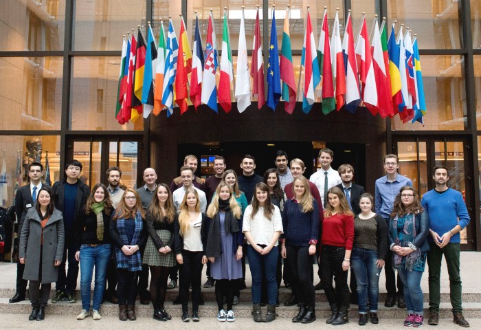 Glasgow Politics students in front of the flags of the EU