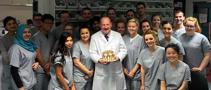 BDS3 students give Dr Cameron a cake