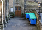 Recycling skips positioned outside 1A Professors Square