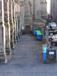 Waste skips positioned outside 1A the Square