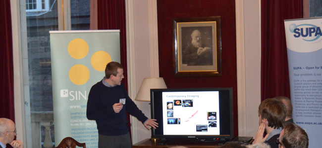 Image of Prof Sandy Cochrane at one of the workshops at the Royal Society of Edinburgh explaining some potential applications of ultrasound.