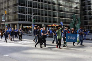 Image of UofG party taking part in the 2015 New York Tartan Day parade 