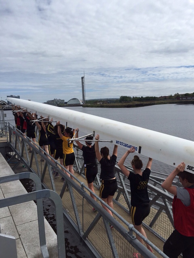 Carrying the boat to the water for the Scottish Boat Race