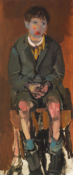 A young boy sitting down.