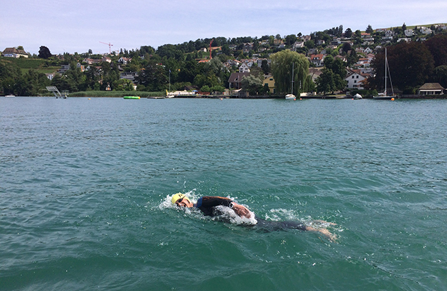 Jason Gill swimming across lake Zurich