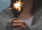 Hands holding a sparkler