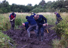 Volunteers digging pond