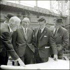 The Cunard visitors scrutinising the plans during their visit.