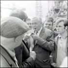 The Prime Minister, Harold Wilson, talks to some of the workers.