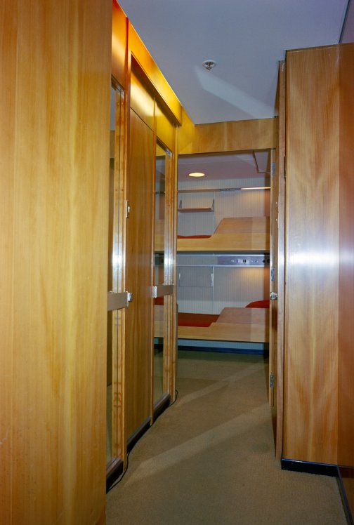 A tourist class cabin with bunk beds.