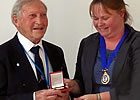 Rufus Ross receives the Lindsay Memorial Medal from Rachel Bairsto , President