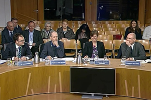 Image of University staff giving evidence at Holyrood