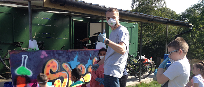 Spray painting a mural at lambhill stables