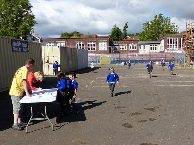 excited pupils run to the activities 