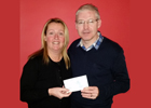 Image of Derek Johnston presenting cheque