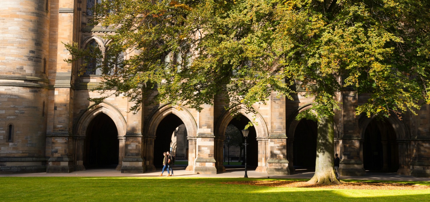 Two visitors exploring the University's Cloisters