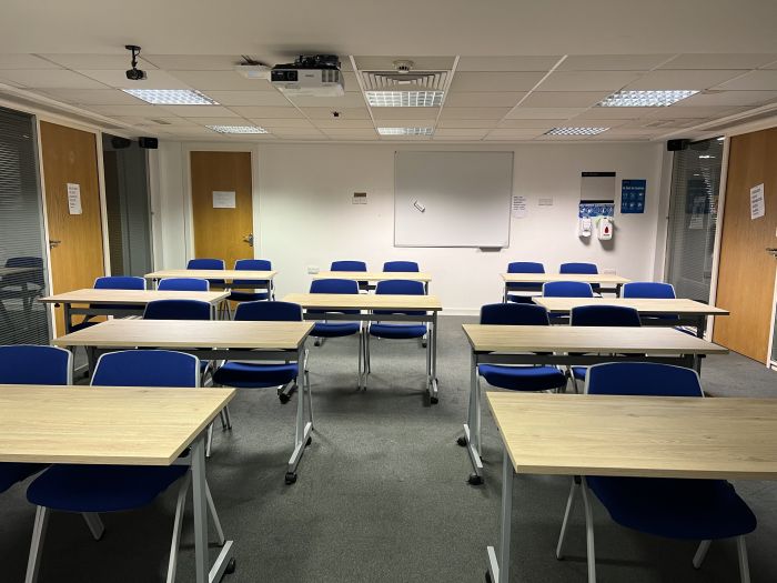 Flat floored teaching room with rows of tablet chairs