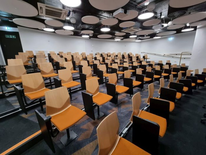 Raked lecture theatre with fixed tablet chairs
