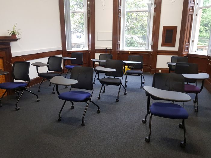 Flat floored teaching room with rows of tablet chairs