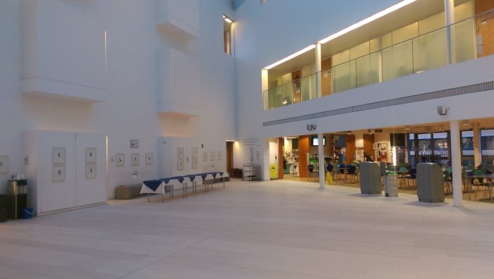 Flat floored atrium area with cafe in rear