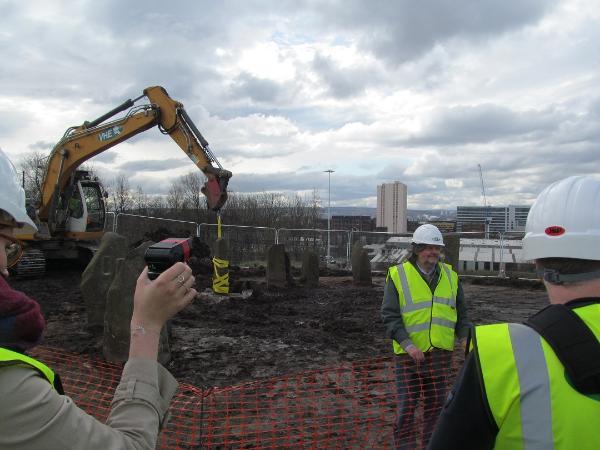 The dismantlement of the Sighthill stone circle in Spring 2016, with its designer, Duncan Lunan, standing in the foreground