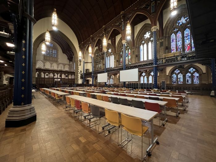 Flat floored hall with rows of tablet chairs