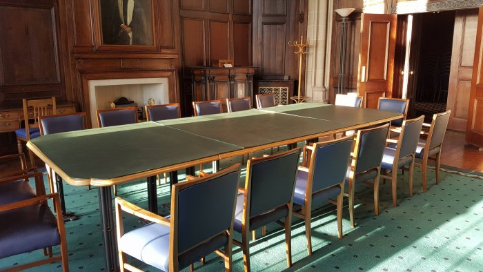 Flat floored meeting room with boardroom table and chairs