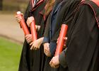 A group of students posing for graduation photos