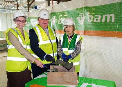 Carol Clugston, MVLS College Secretary; Robert Calderwood, Chief Executive of NHS Greater Glasgow and Clyde; and Professor Dame Anna Dominiczak, Vice Principal and Head of the College of Medical, Veterinary and Life Sciences; at the topping out ceremony