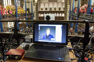 Image of Edward Snowden the University Rector on a lap top screen in the Bute Hall