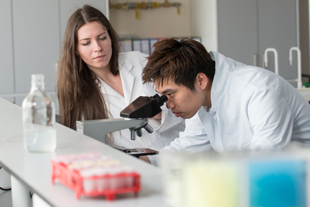 Photo of two researchers in lab