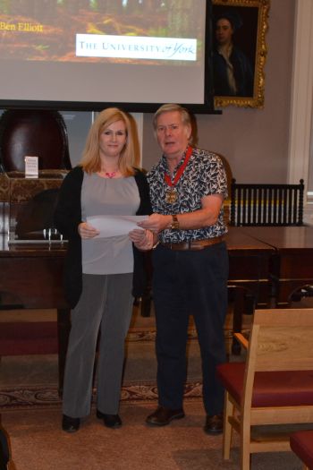Alex receives her certificate from Prehistoric Society President Alex Gibson