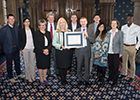 Image of the Procurement EandB teams with their Gold Award.