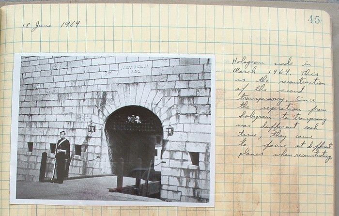 A page from a notebook in Prof Johnston's collection. Image of a guard at a gate. Note reads: “18 June 1964. Hologram made in March 1964. This is the reconstruction of the second transparency. Since the separation from hologram to transparency was different each time, they come to focus at different places when reconstructing.”