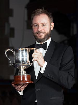 Matt Fountain with his Young Alumnus of the Year trophy, December 2016