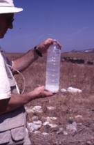 alumen dissolving in bottle of water at Aghia Kyriaki site