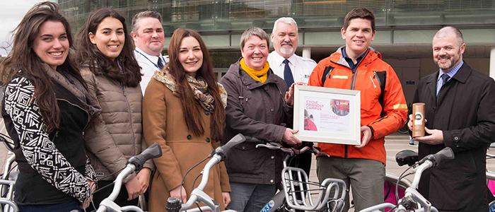 Image of the University Cycle Friendly team being presented with their award.