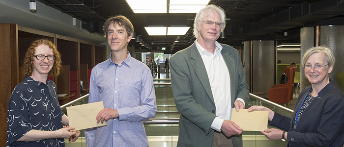 Edward Cole (winner) and Stephen Hall (runner up) receiving their cheques from Susan Ashworth and Julie Gardham