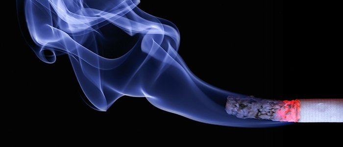 Image of a lit and burning cigarette with ash