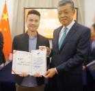 Yiwei Zhang receives 2016 Chinese Government Award from the Chinese ambassador, Xiaoming Liu. 