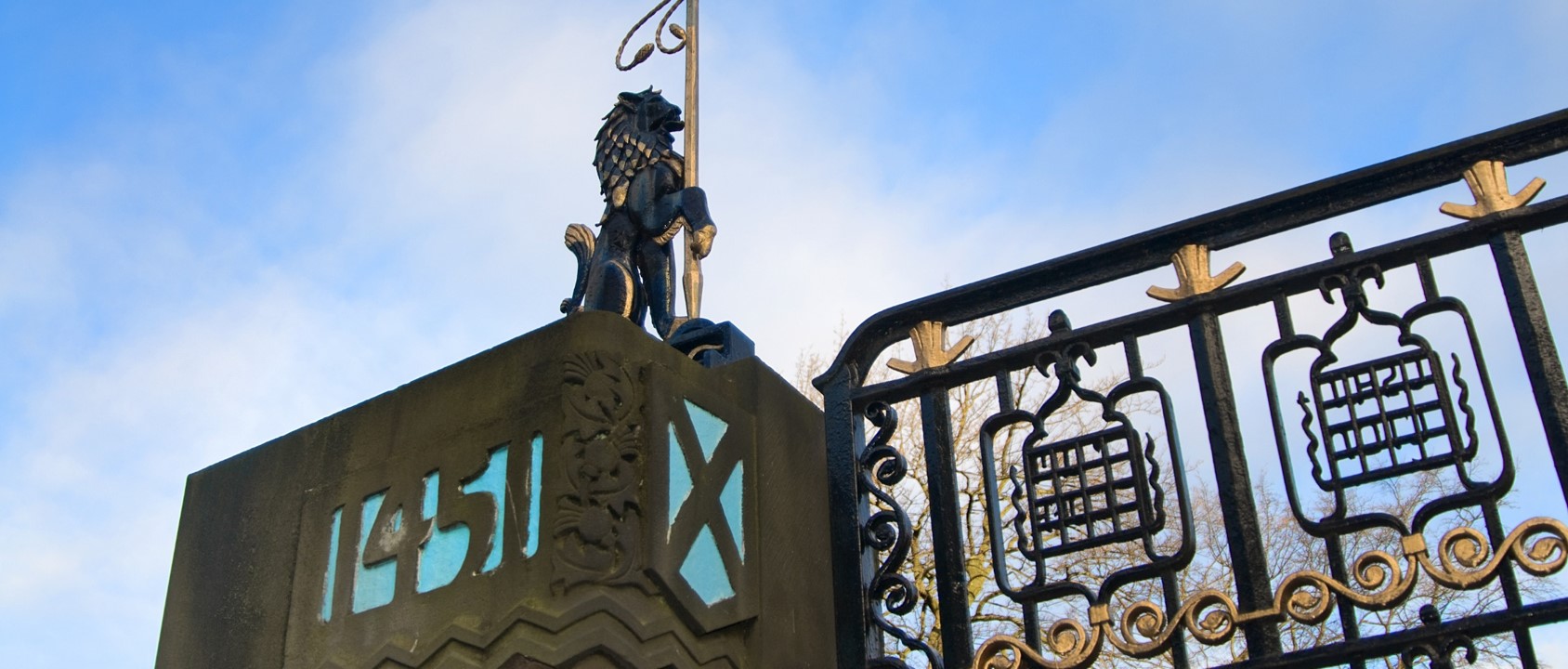 The University's Memorial Gate against a blue sky