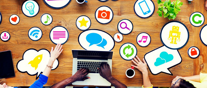 Image of a table top, icon images and human hands