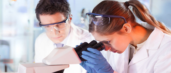 Image of a researcher using microscope