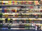 Blurred photo of alcohol bottles on a shop shelf