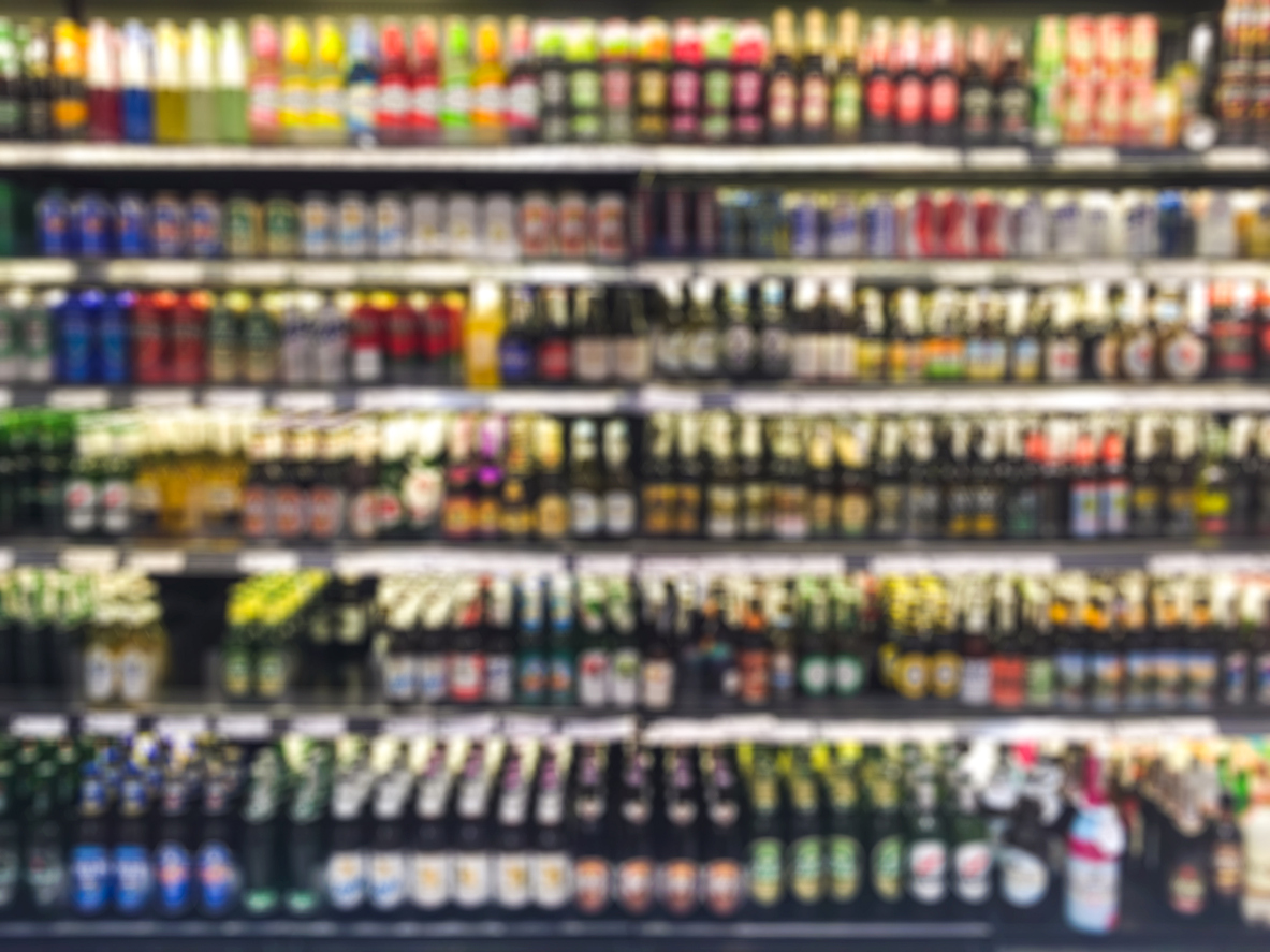 Blurred photo of alcohol bottles on a shop shelf