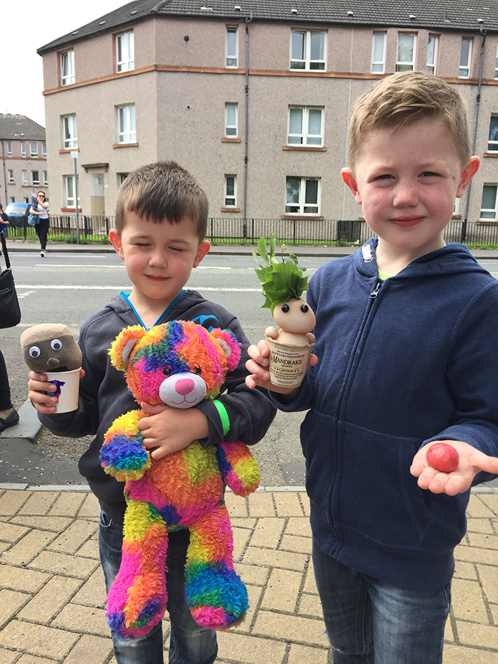 Attendees show off their magical science creations from the day