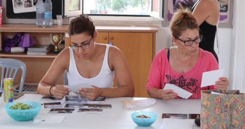 Antigoni and Maria Reviewing Photographs