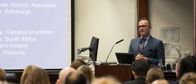 Photo of Professor Brendan McCormack presenting lecture