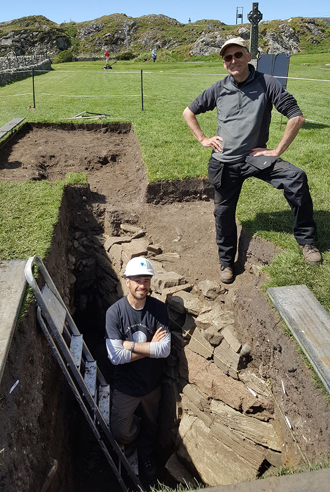 University of Glasgow archaeologists Ewan Campbell (above) and Adrián Maldonado (below) after first exposing the new early wall foundation on Iona Abbey in May 2017.